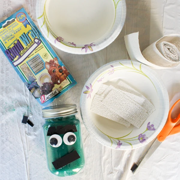 Create adorable mason jar mummies candleholders for Halloween!